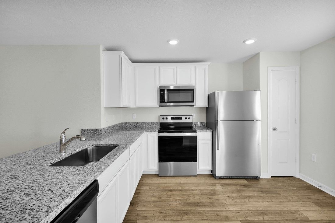 The kitchen comes chef ready with stainless steel appliances