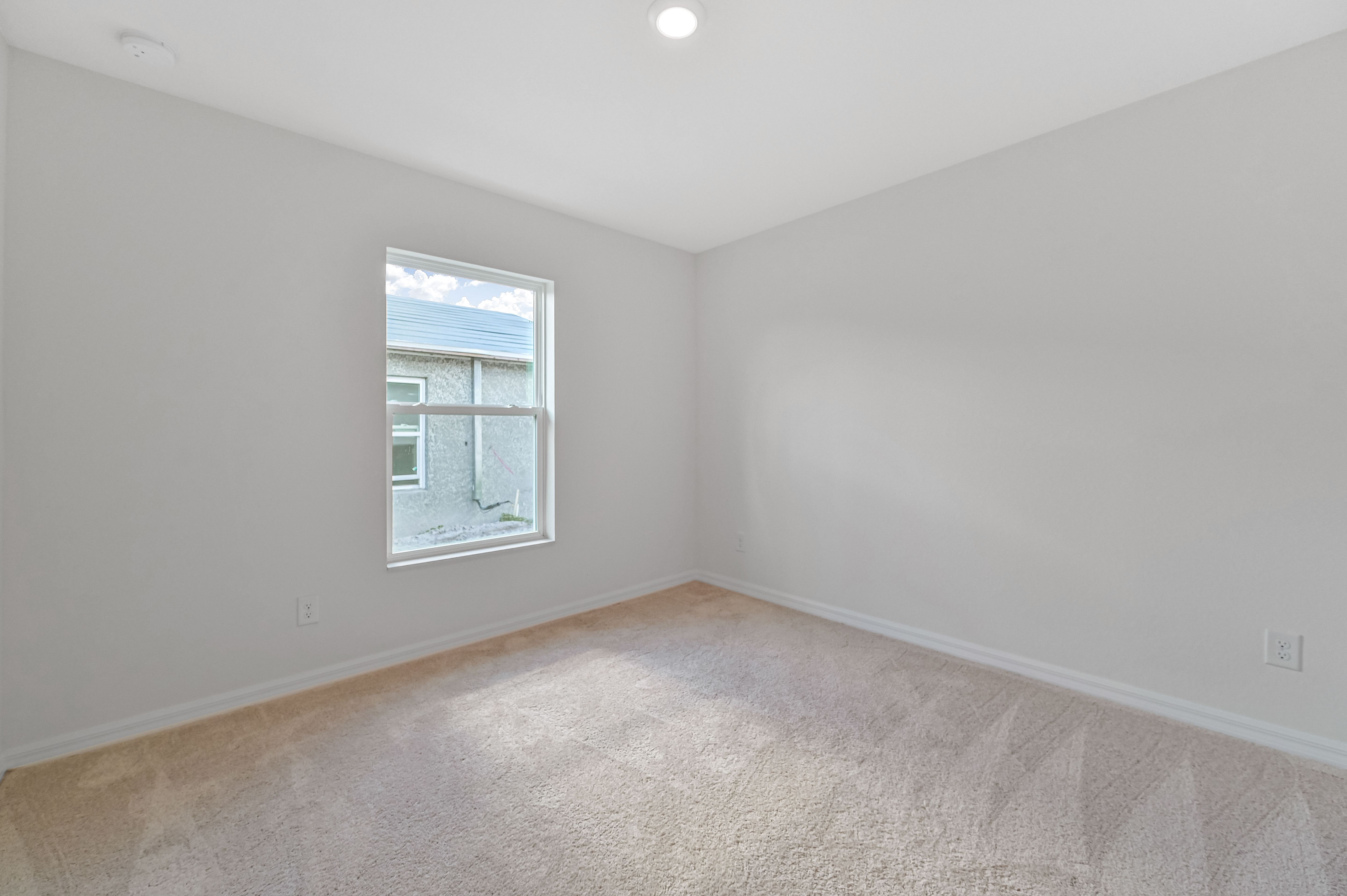 The spare bedroom of the Capri is also spacious and has natural lighting