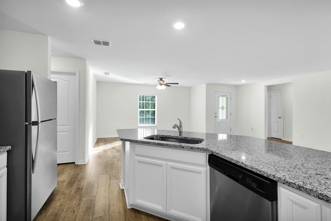 The kitchen comes chef-ready with stainless steel appliances