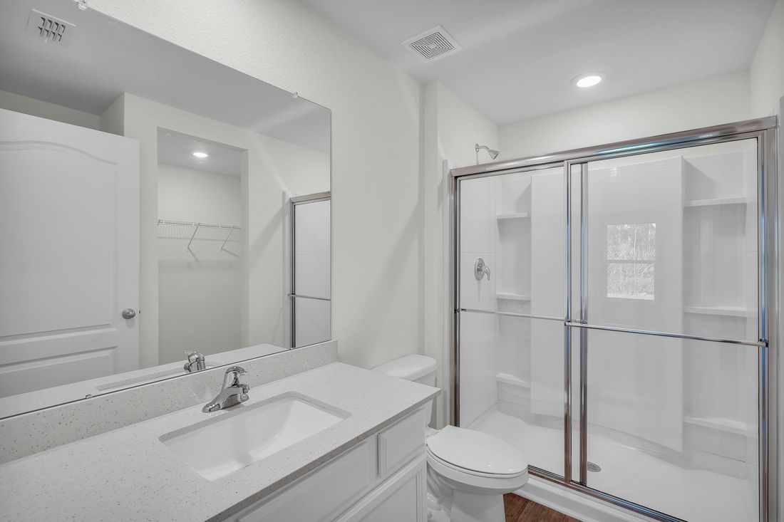 The master bathroom has a large walk in shower