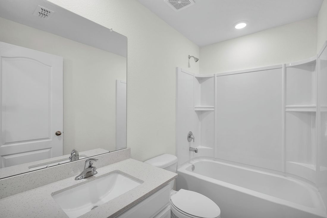 The spare bathroom has a large vanity ready for you guests to get ready at