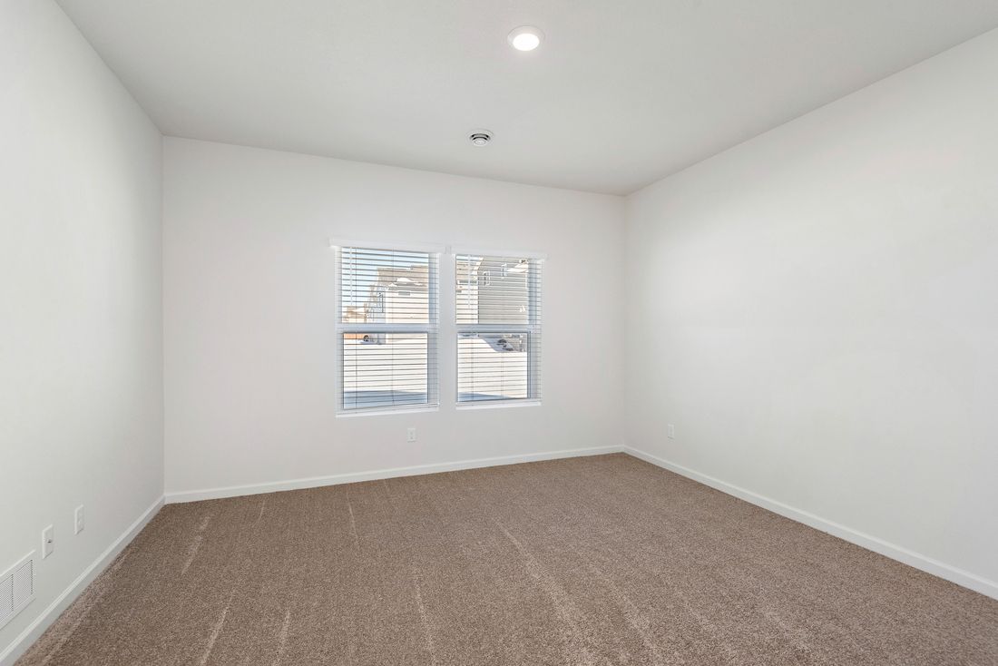 Large master bedroom with great windows.