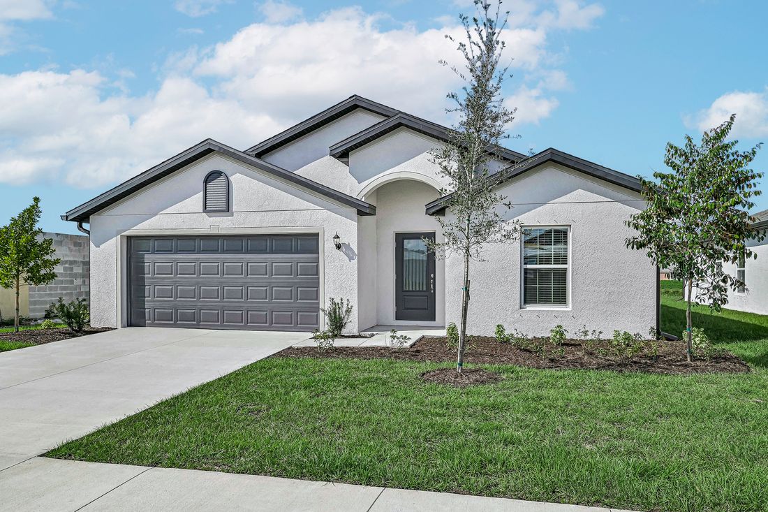 The Estero has great curb appeal and welcomes you into the home with a 3/4 lit door
