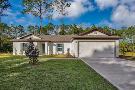 a beautiful single story home with a two car garage