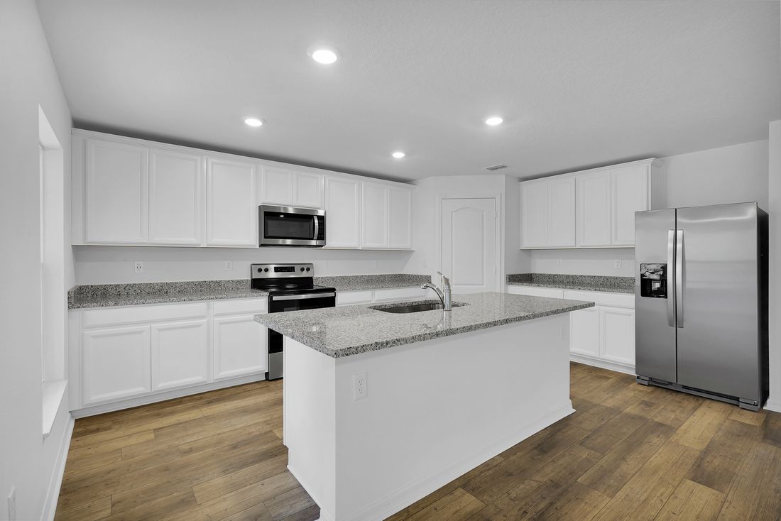This move-in ready home features gorgeous granite countertops in the kitchen
