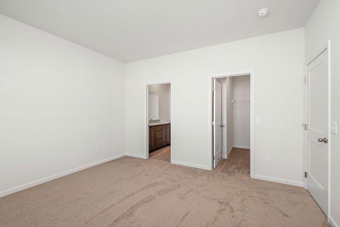 The master bedroom is spacious and has access to its own bathroom