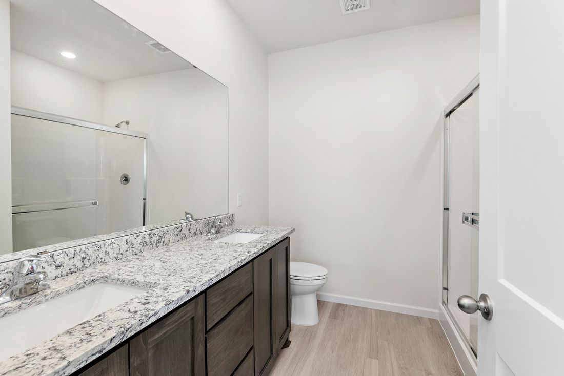 The master bathroom has a large vanity