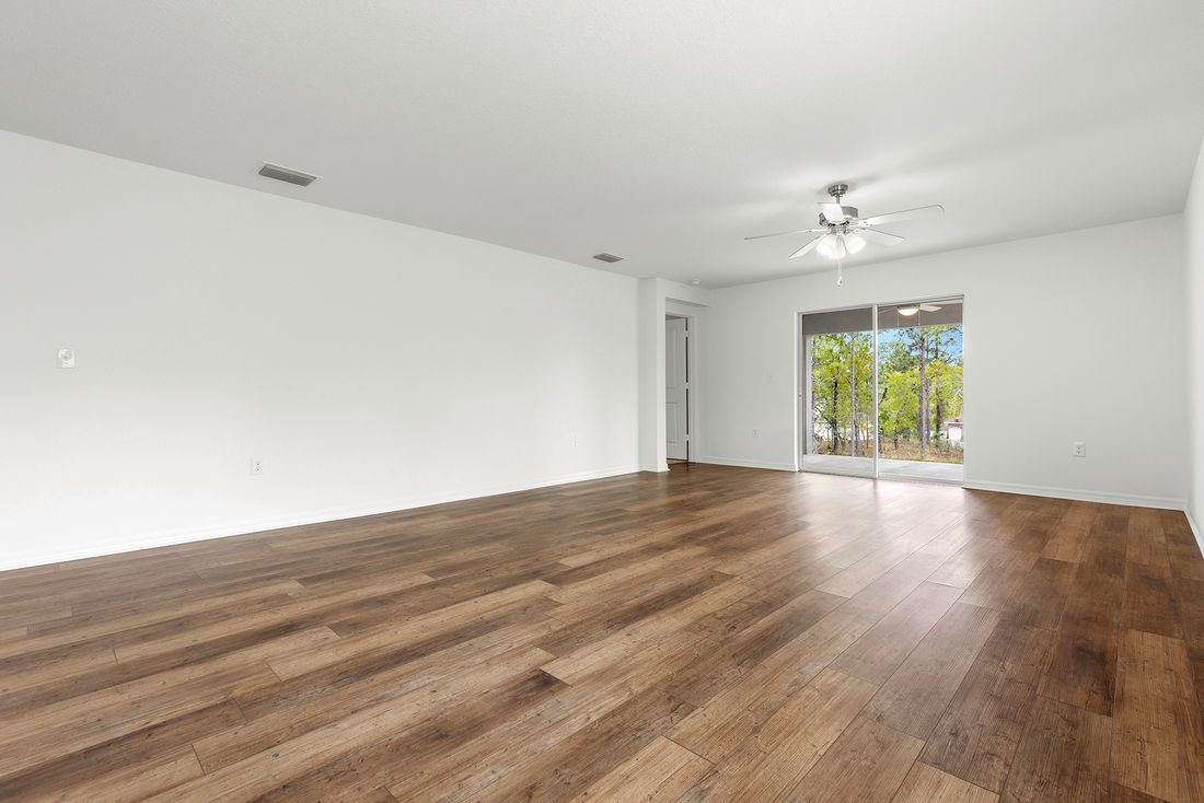 The family room is spacious with a sliding glass door to the back patio
