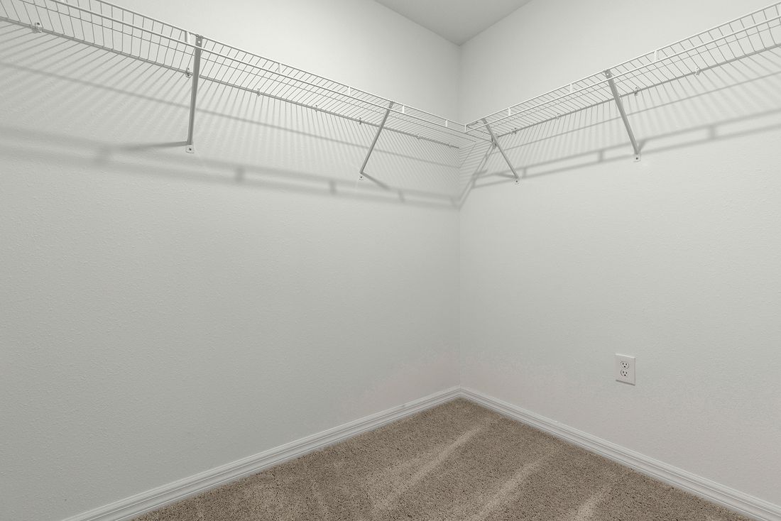The walk in closet is big enough for all of your wardrobe needs