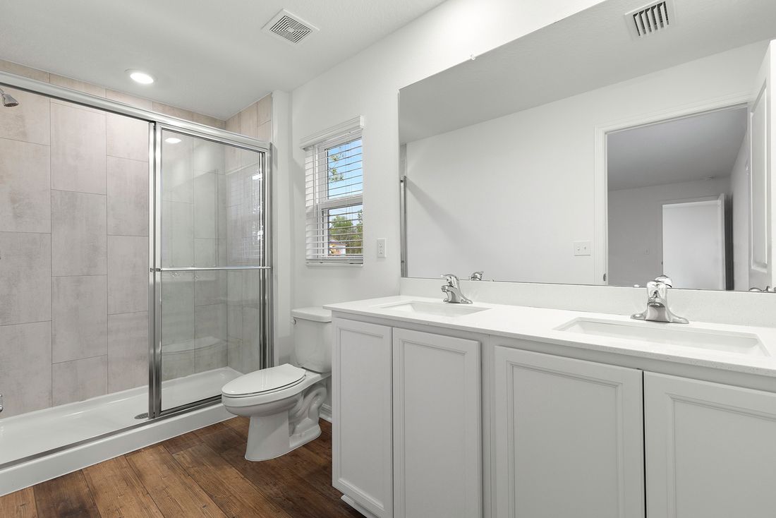 The master bathroom is has a large vanity to help you get ready