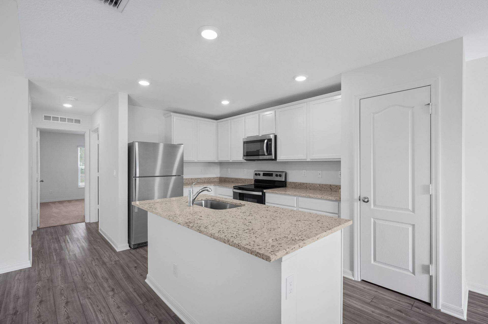 The kitchen is chef-ready with stainless steel appliances