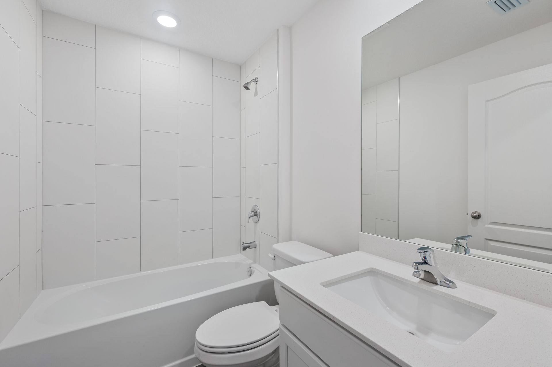 The guest bathroom has a spacious vanity