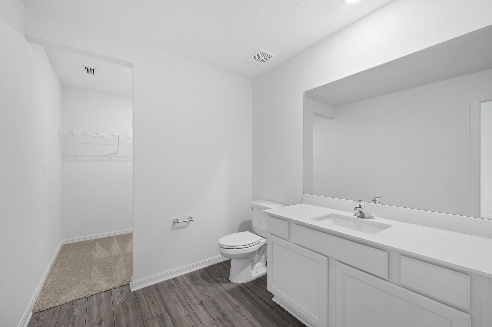 The master bathroom has a step in shower