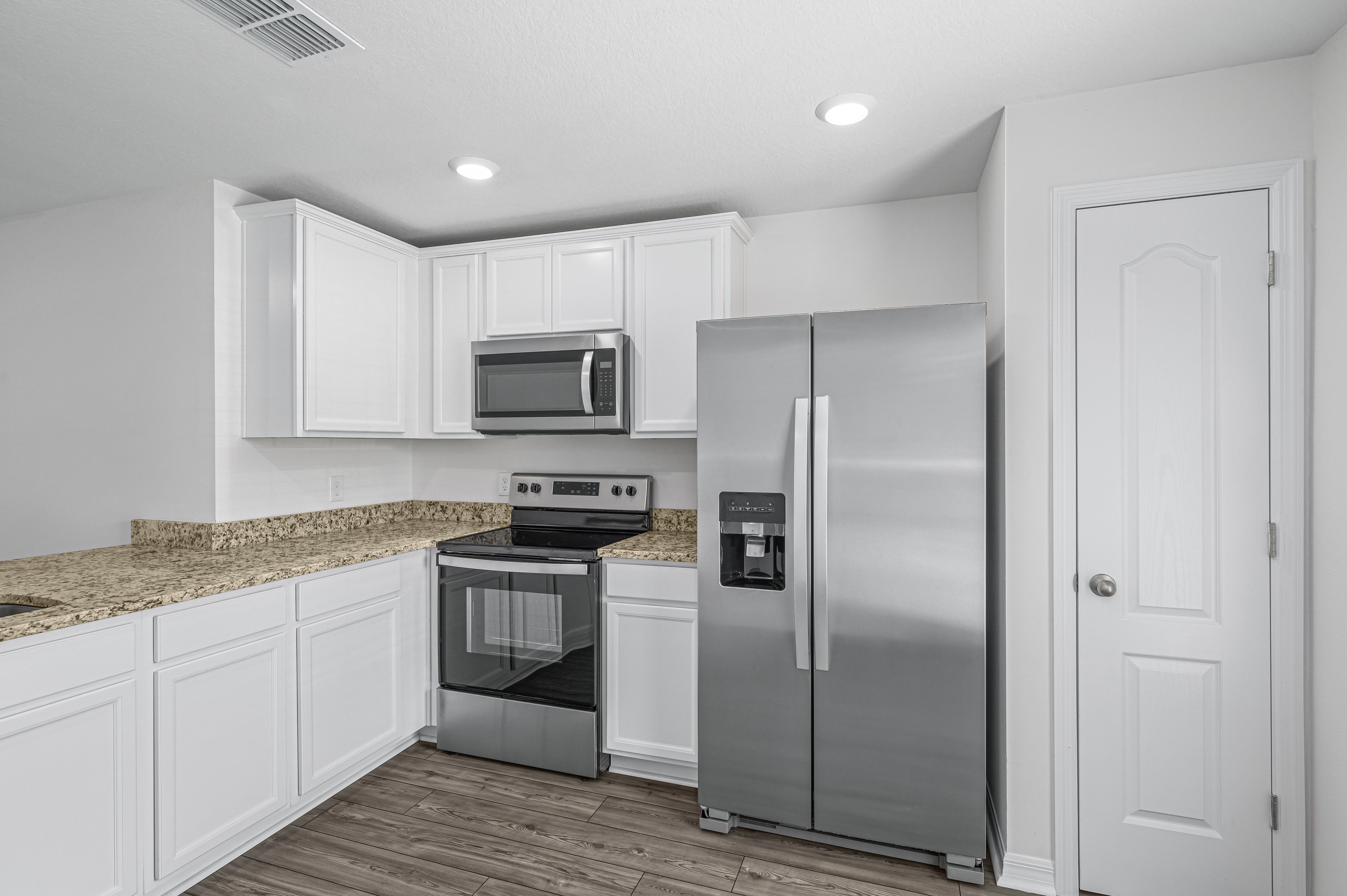 The kitchen comes chef ready with stainless steel appliances