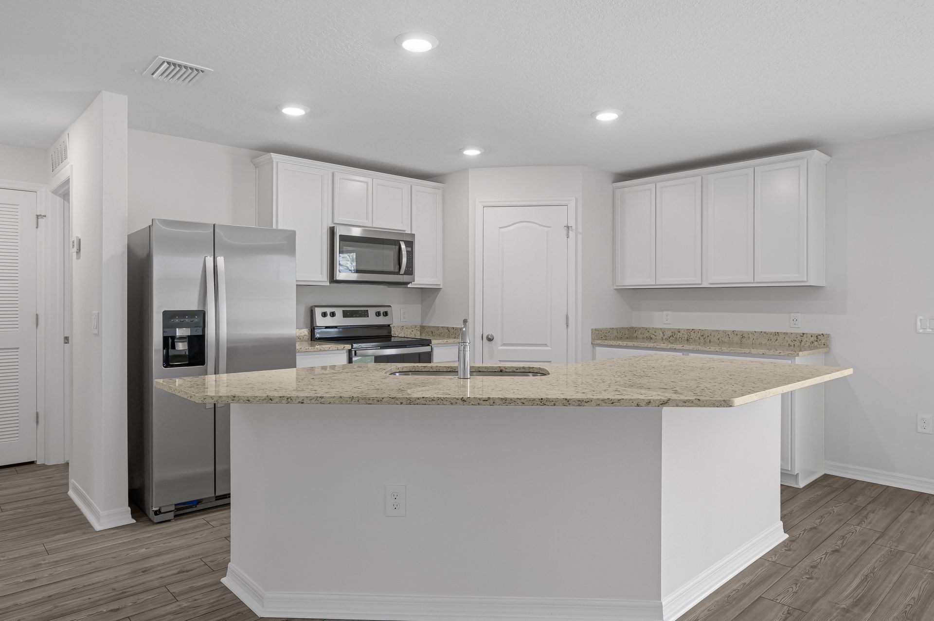 The kitchen comes chef-ready with stainless steel appliances