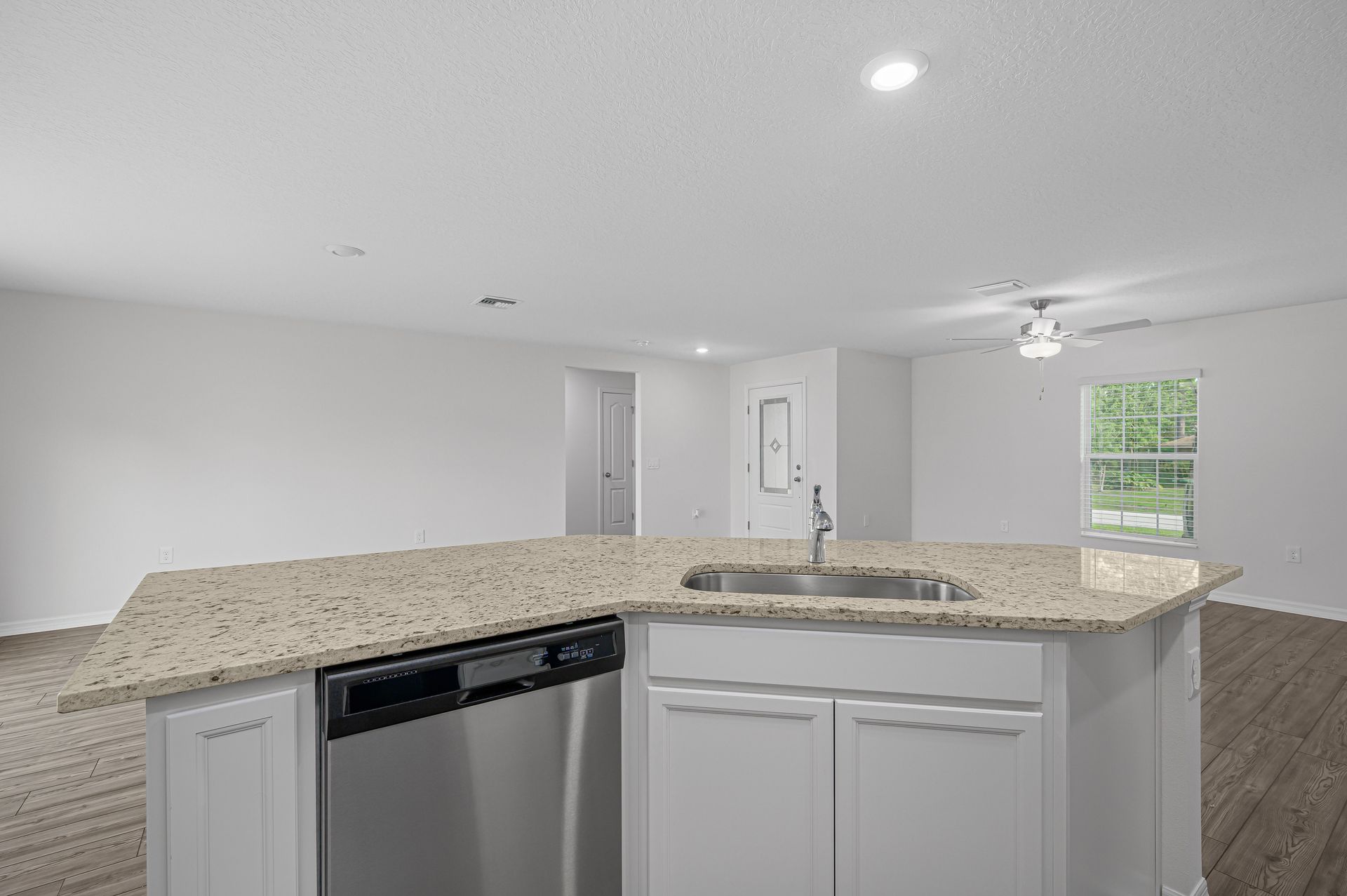 The kitchen has a large island that will be perfect for you and your family to gather around