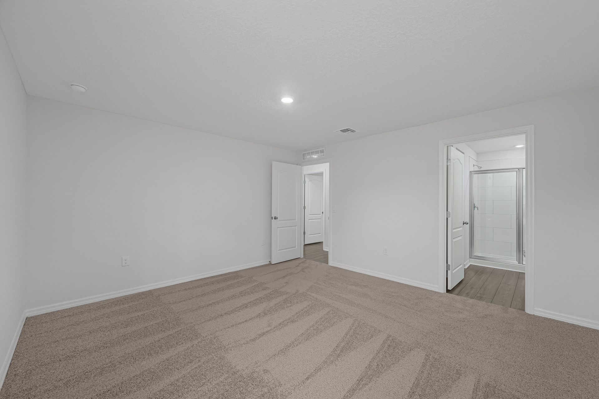 The master bedroom is spacious and has a walk in closet and bathroom attached