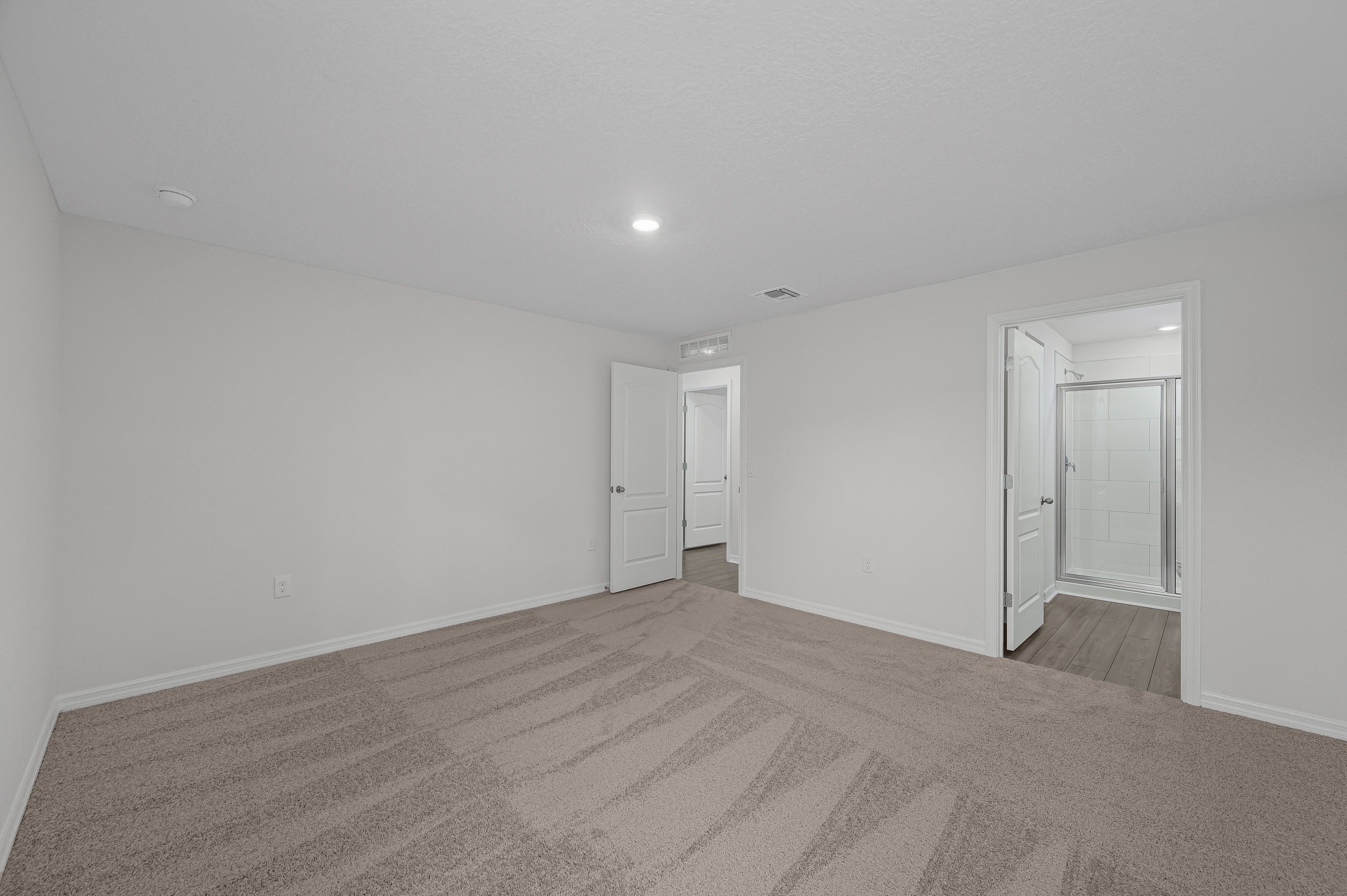 The master bedroom is spacious and has a walk in closet and bathroom attached