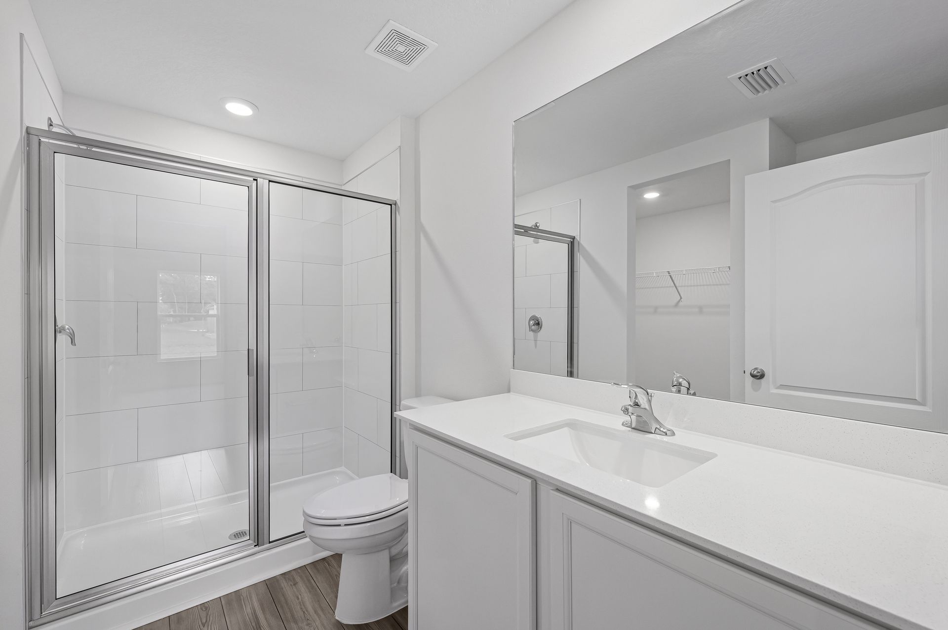 The master bathroom has a large walk in shower