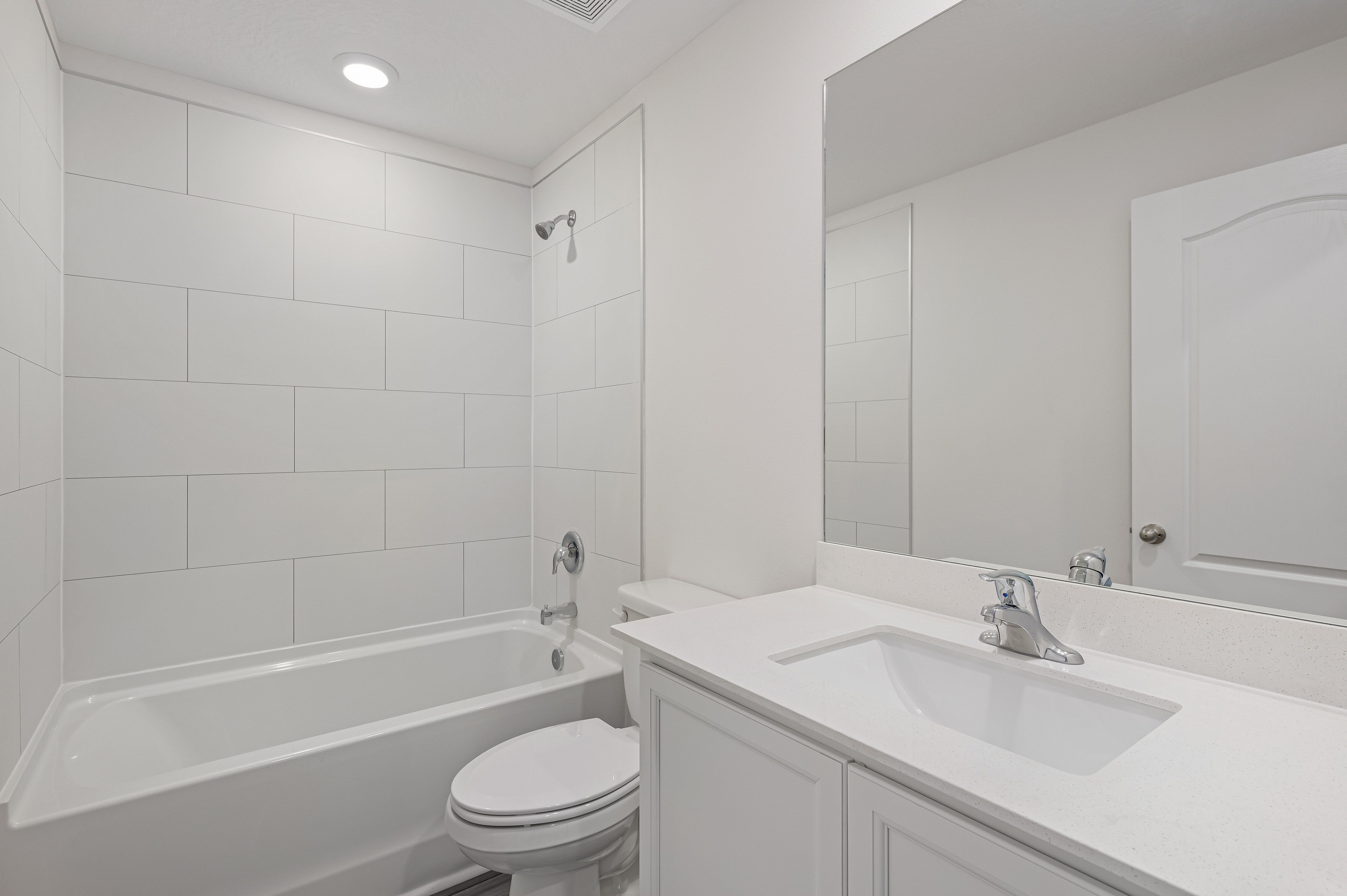 The spare bathroom has a large vanity ready for you guests to get ready at