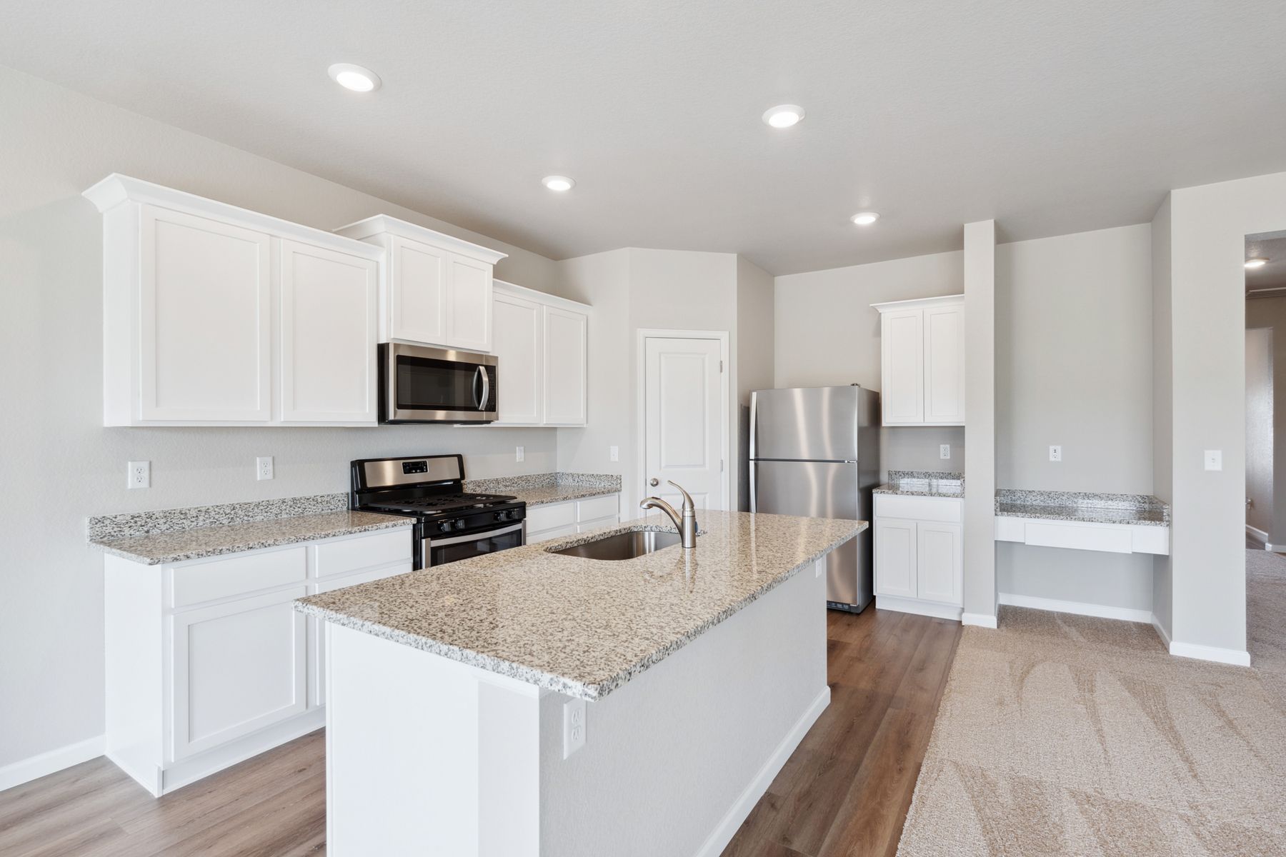 The kitchen in the Pike has beautiful, granite countertops.