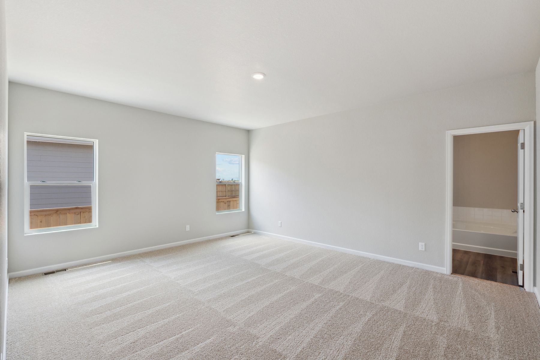 The master suite includes a bedroom, private bathroom and walk-in closet.
