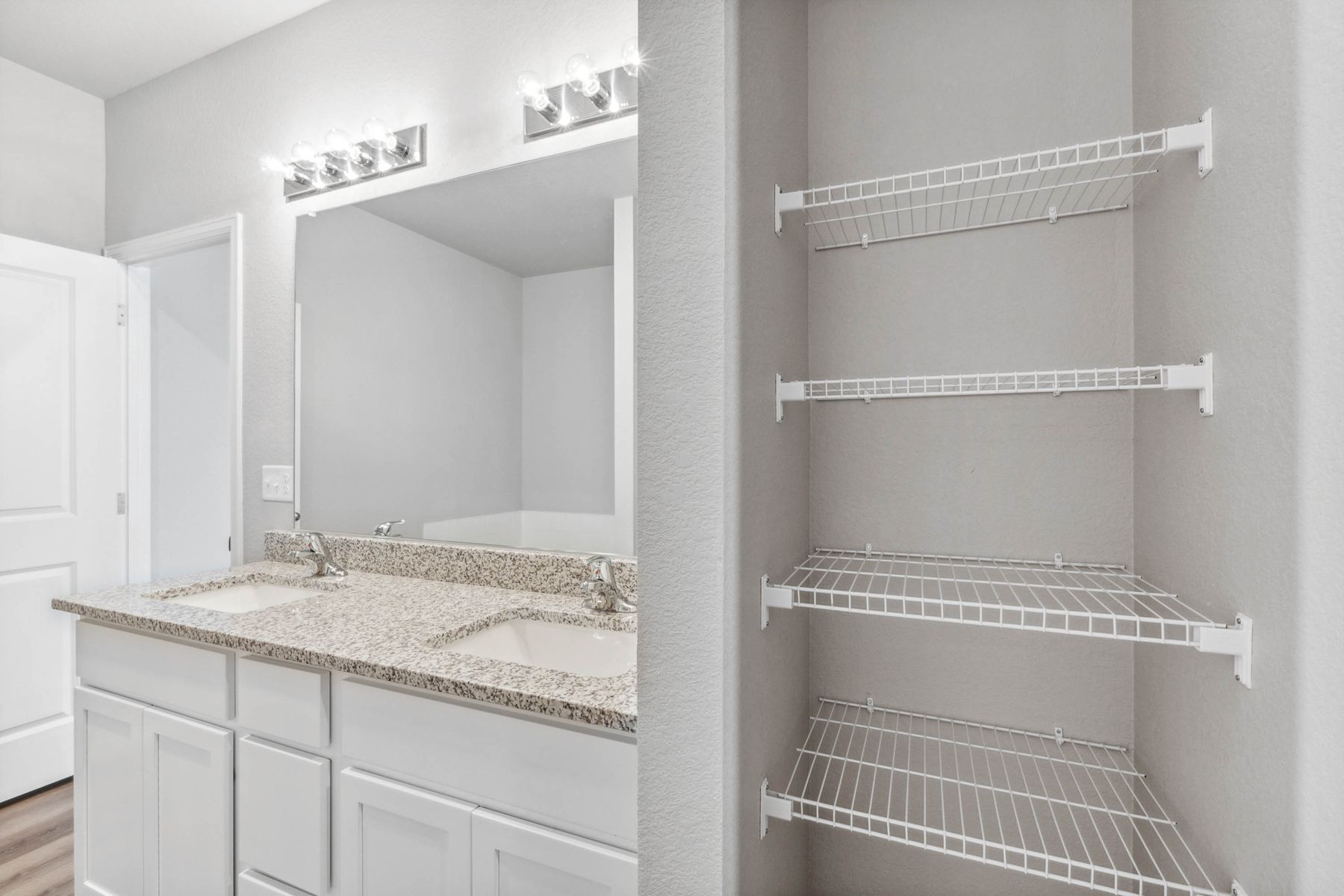 The master bathroom has built in shelves that are perfect for storing linens and toiletries.