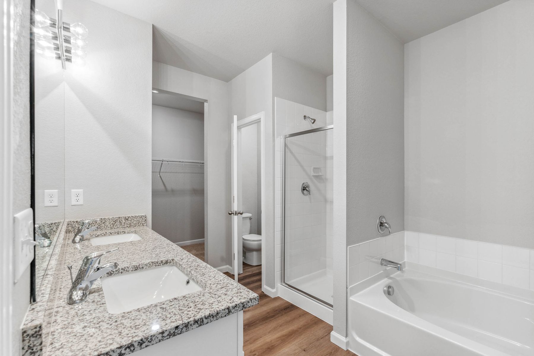 The private master bathroom has private toilet area.
