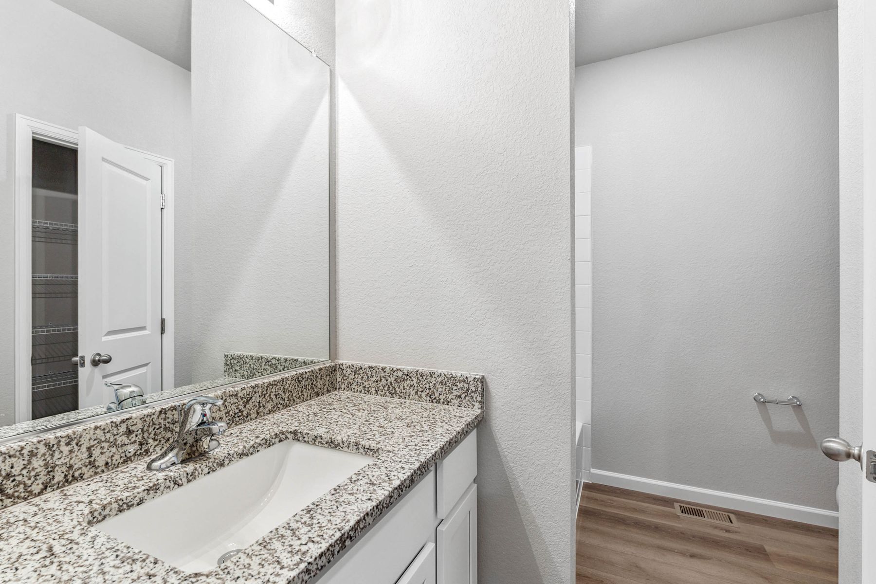 The secondary bathroom has a wonderful vanity.