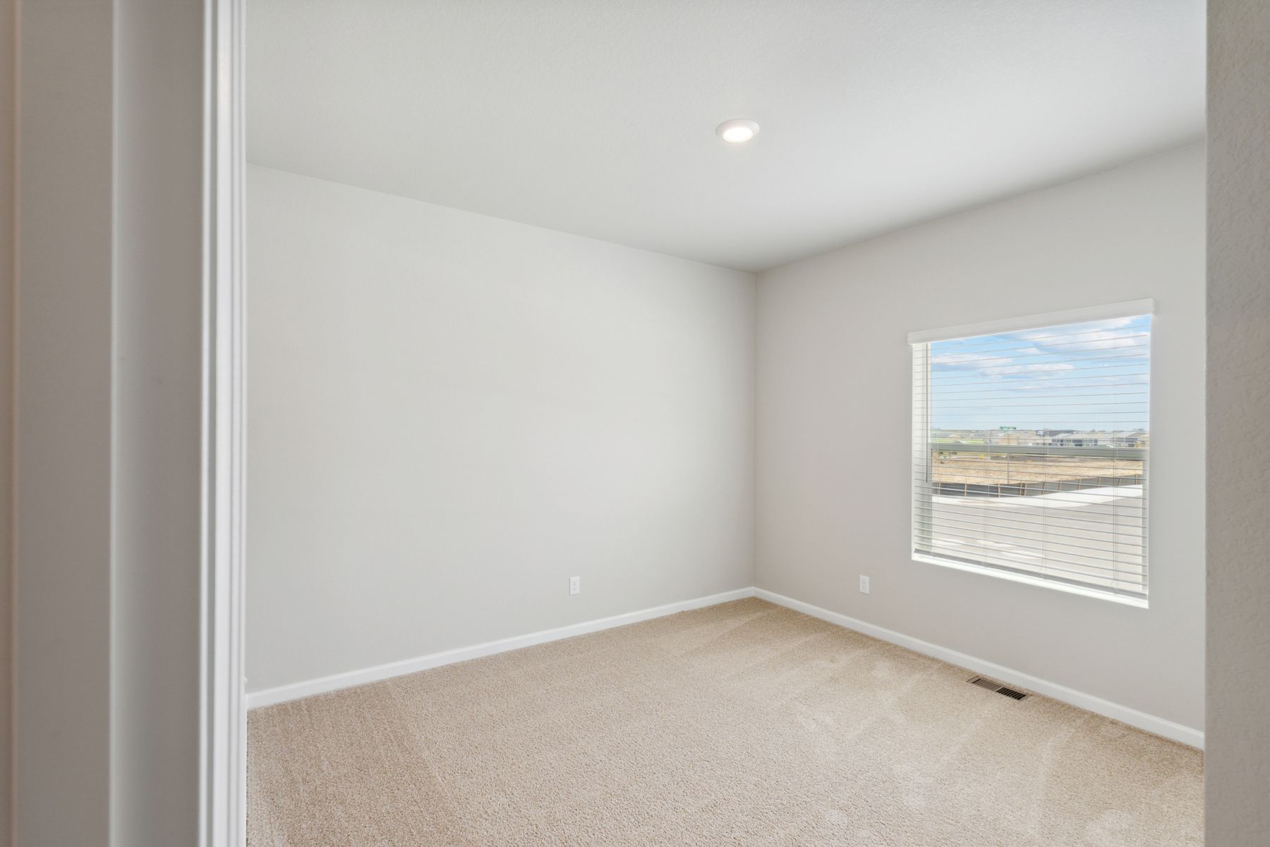 The second bedroom is a great space for a children's room or as a guest room.
