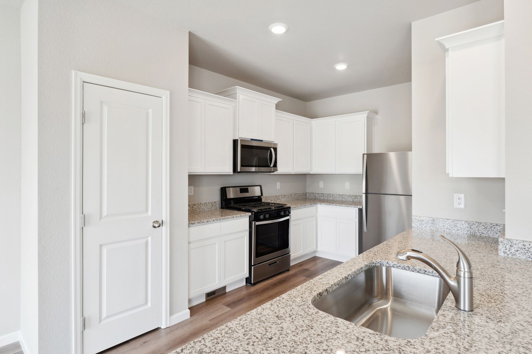 The kitchen of the Chatfield has sprawling granite countertops.