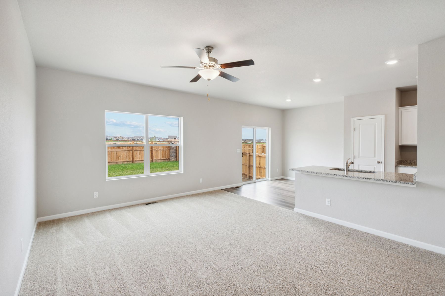 The windows in the living room of the Chatfield allow in great natural light.