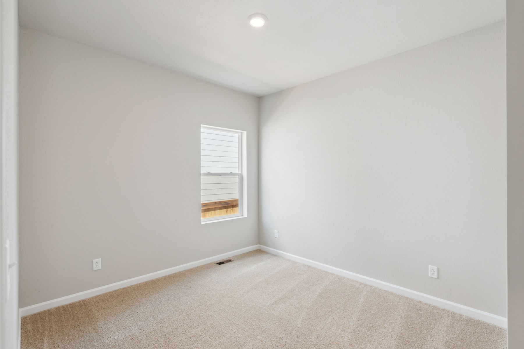 The third bedroom in the Chatfield is perfect as a child's room, or as a home office.