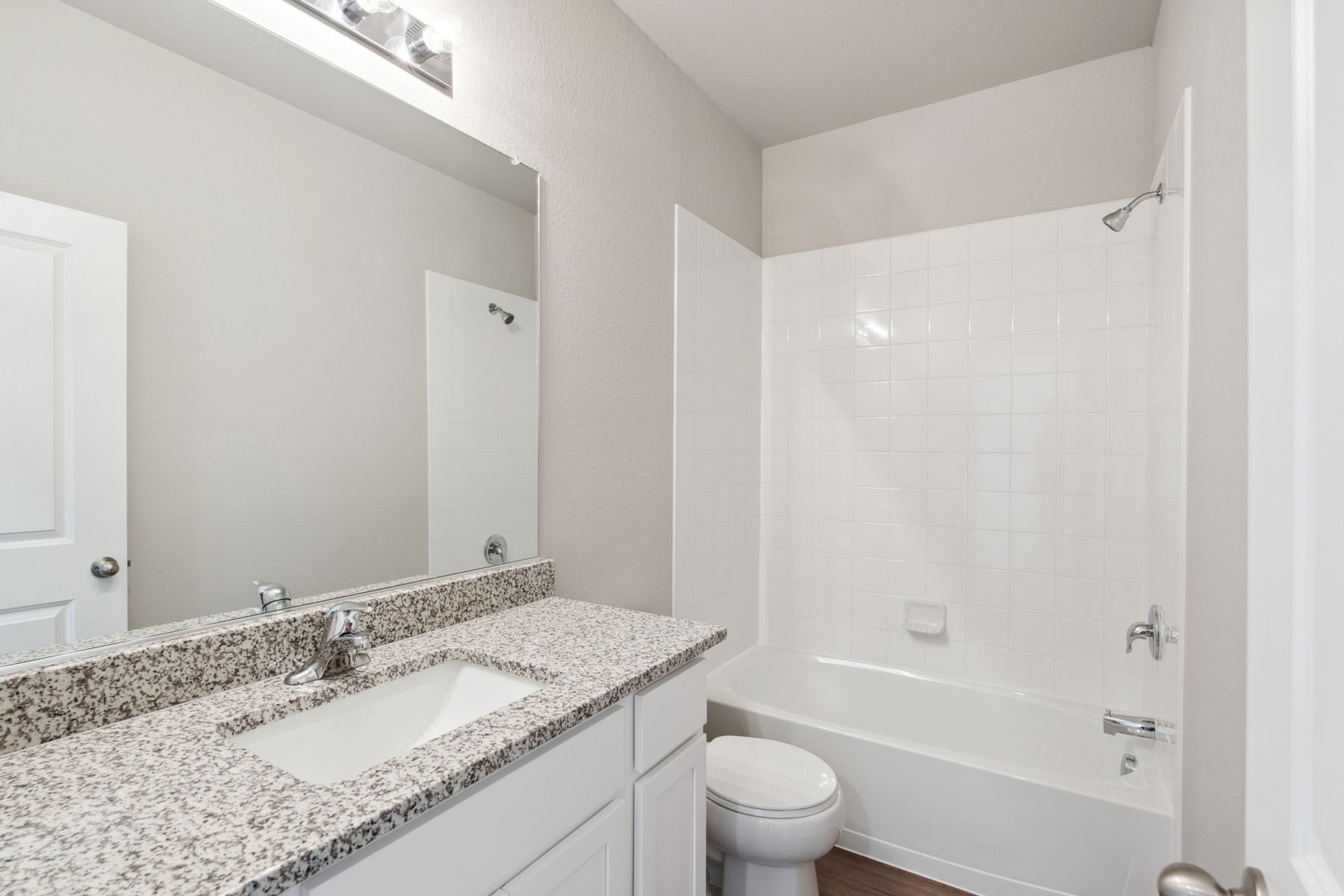 The secondary bathroom in the Chatfield has a shower-tub combo.