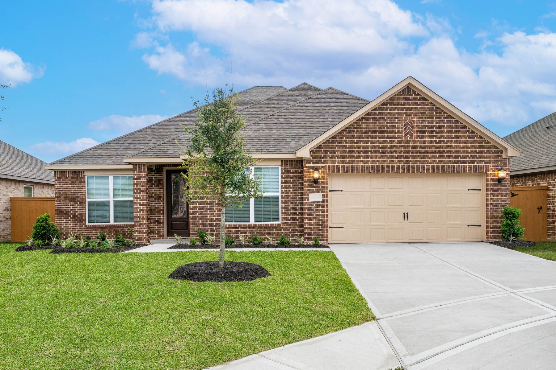 The Dockery is a single story home with brick and stone.