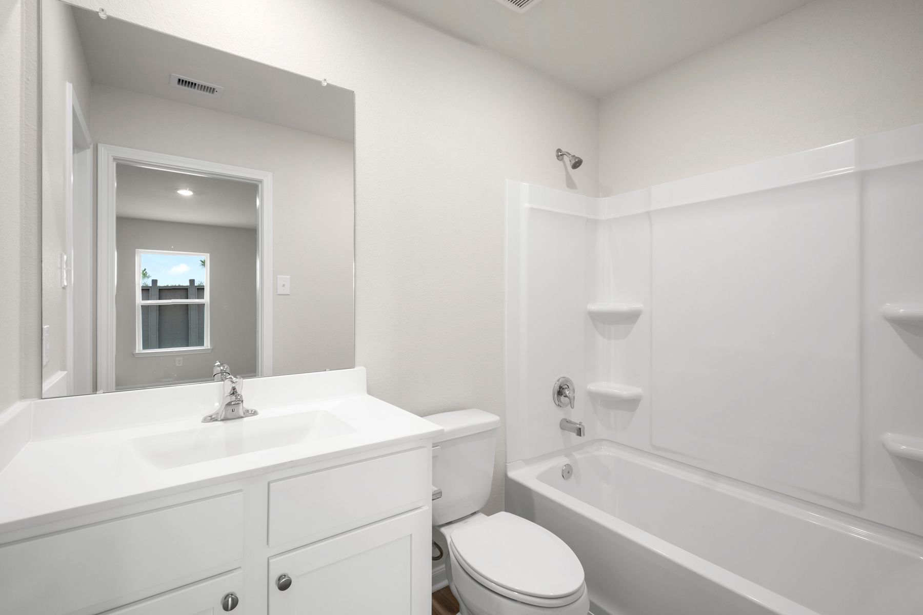 Pamper yourself in the master bathroom featuring a shower/tub combo.