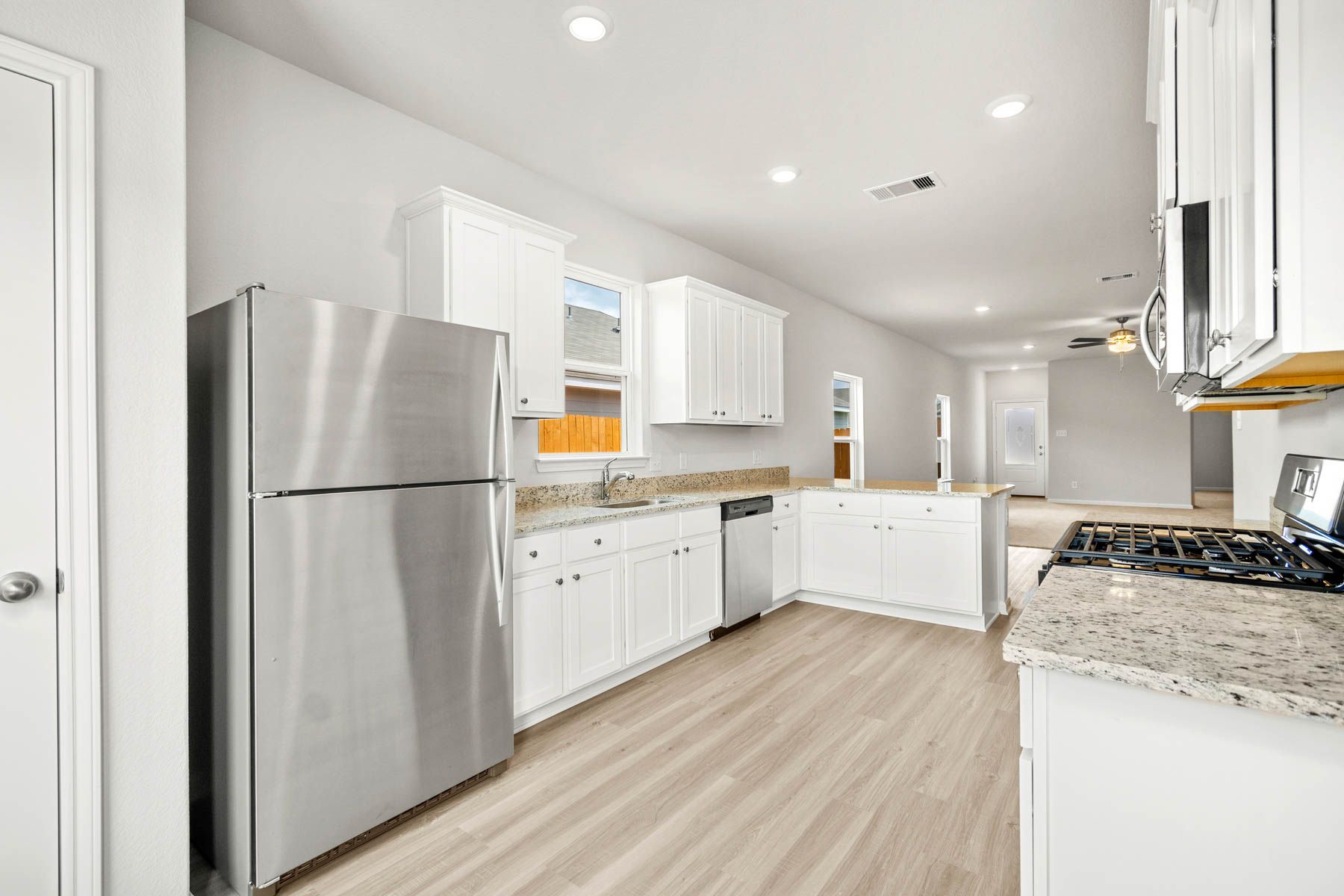 Your new kitchen includes a full suite of stainless steel appliances by Whirlpool.