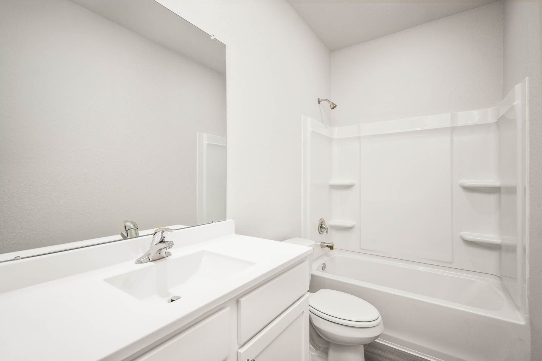 The secondary bathroom has a tub/shower combo.