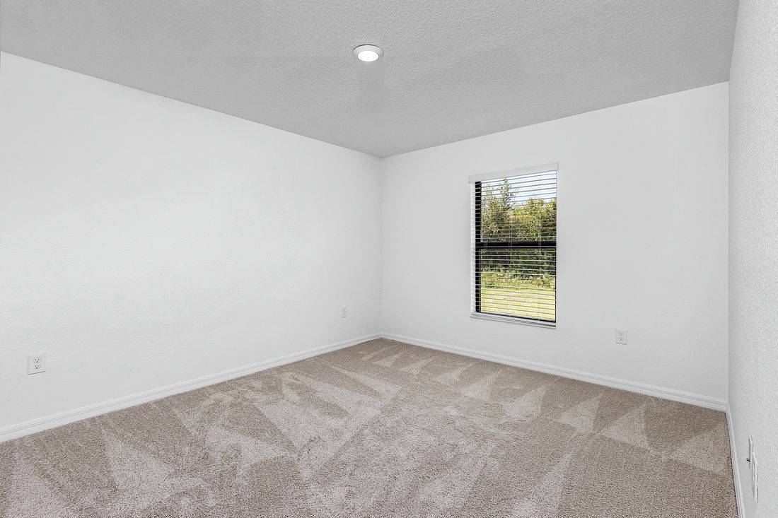 The secluded master bedroom is the perfect place to relax after a long day 