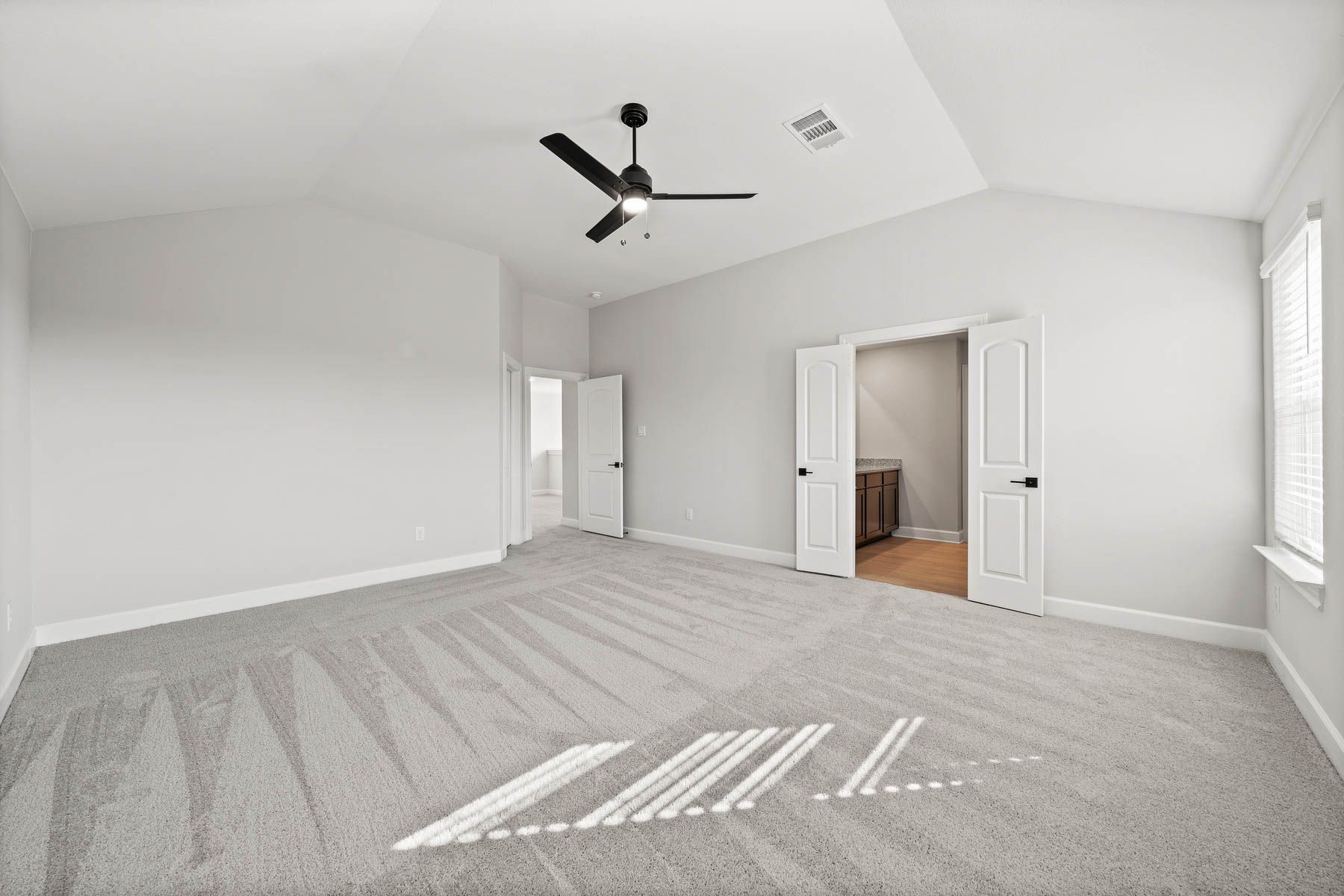 The master suite of the Yaupon includes a bedroom, bathroom and walk-in closet.