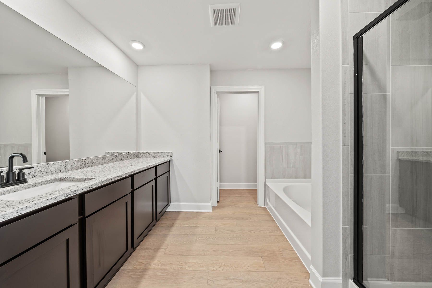 The master bathroom has plenty of counterspace.