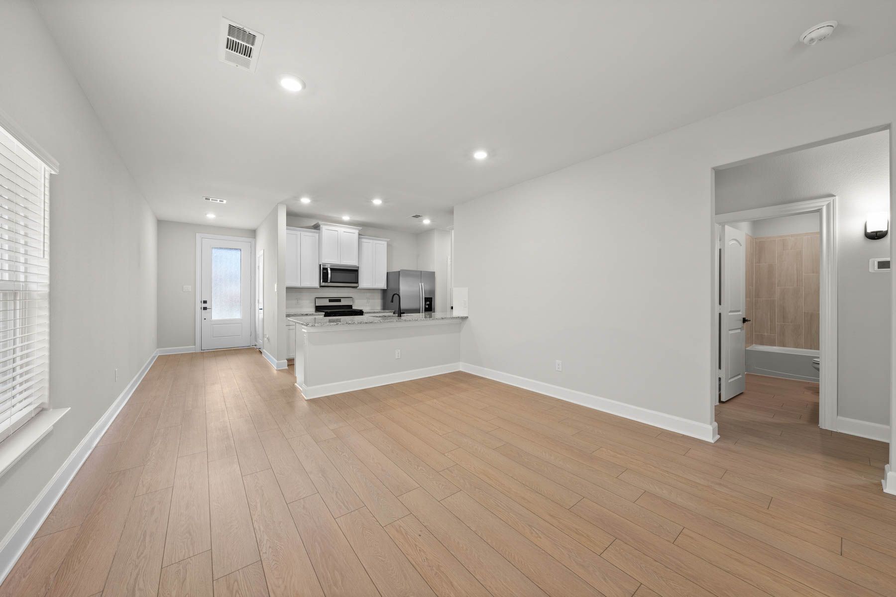The Cedar has beauiful wood-style flooring throughout the home.