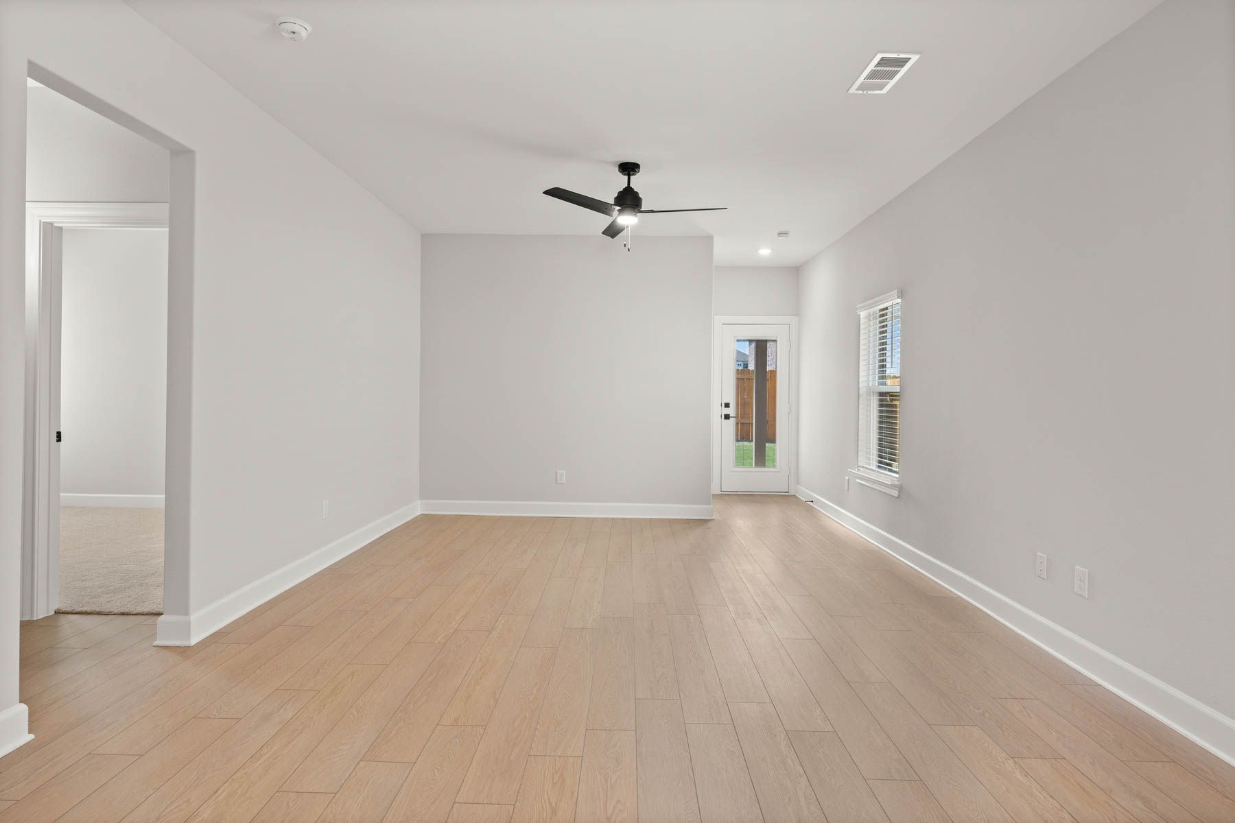 The family room of the Cedar has plenty of space for furniture.