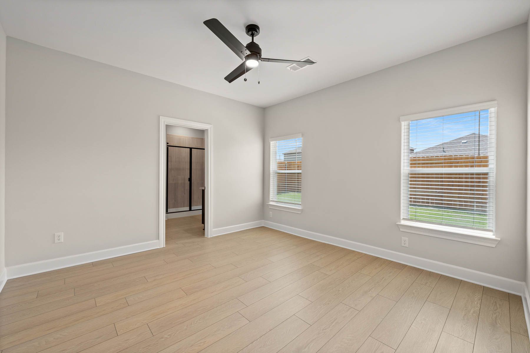 The master suite includes a bedroom, private bathroom and walk-in closet.