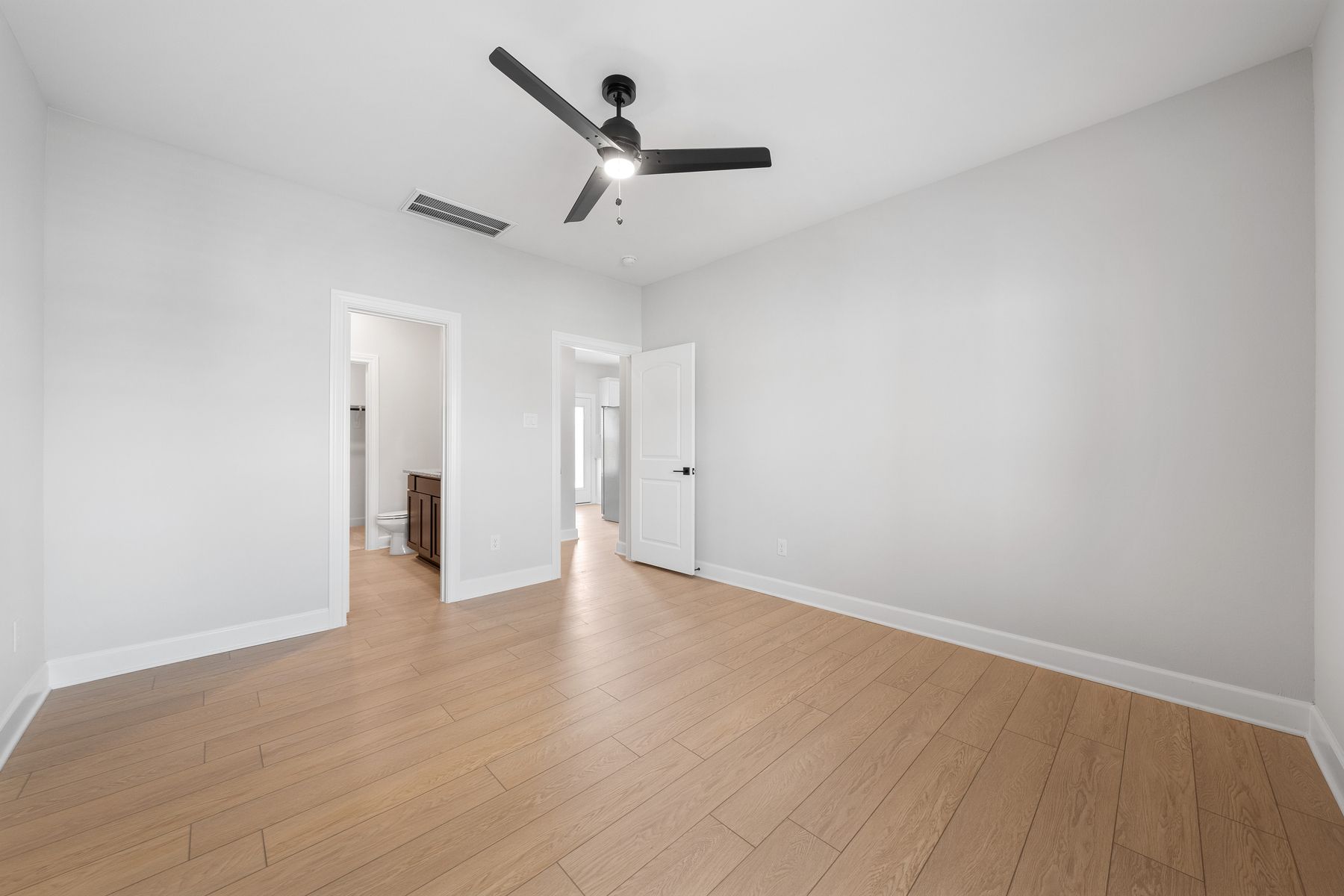 The master suite includes a spacious bedroom, private bathroom and walk-in closet.