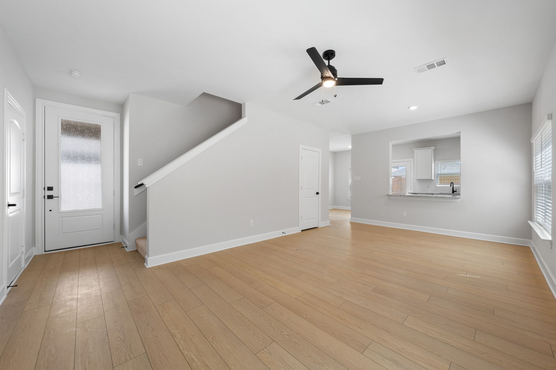 The family room of the Piper is large and has a window that lets in great natural light.