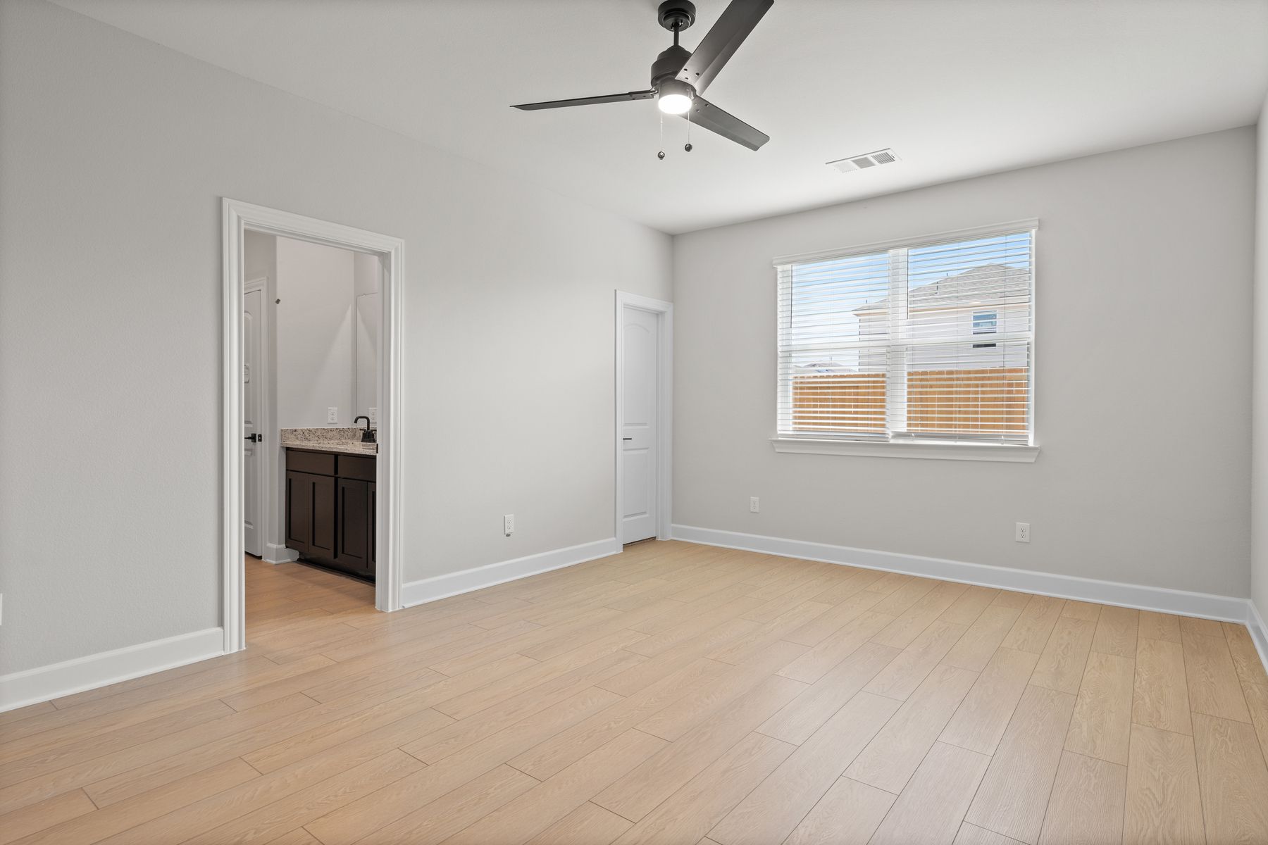 The master suite has a large bedroom, private bathroom and walk-in closet.
