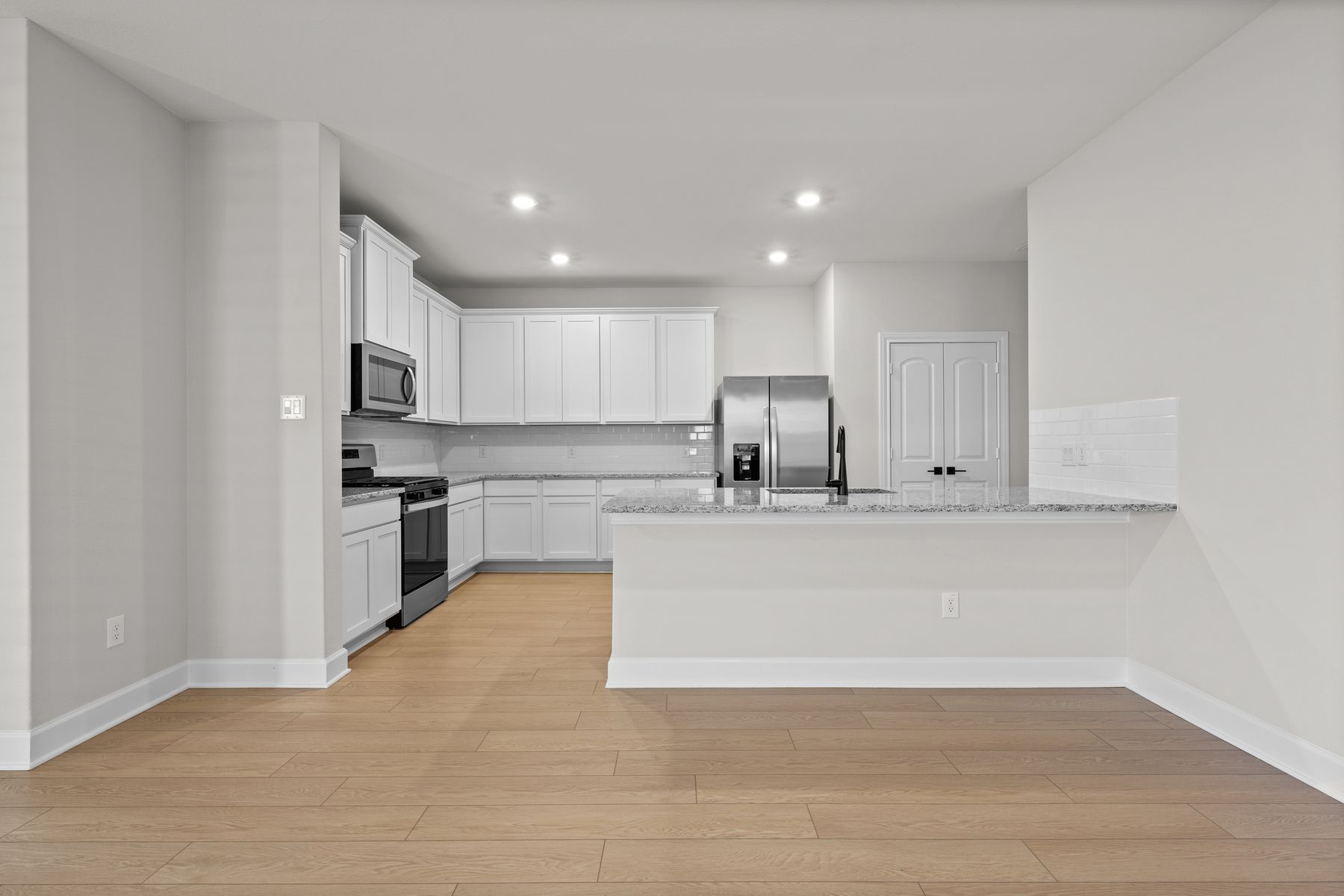 The kitchen of the Willow has granite countertops.