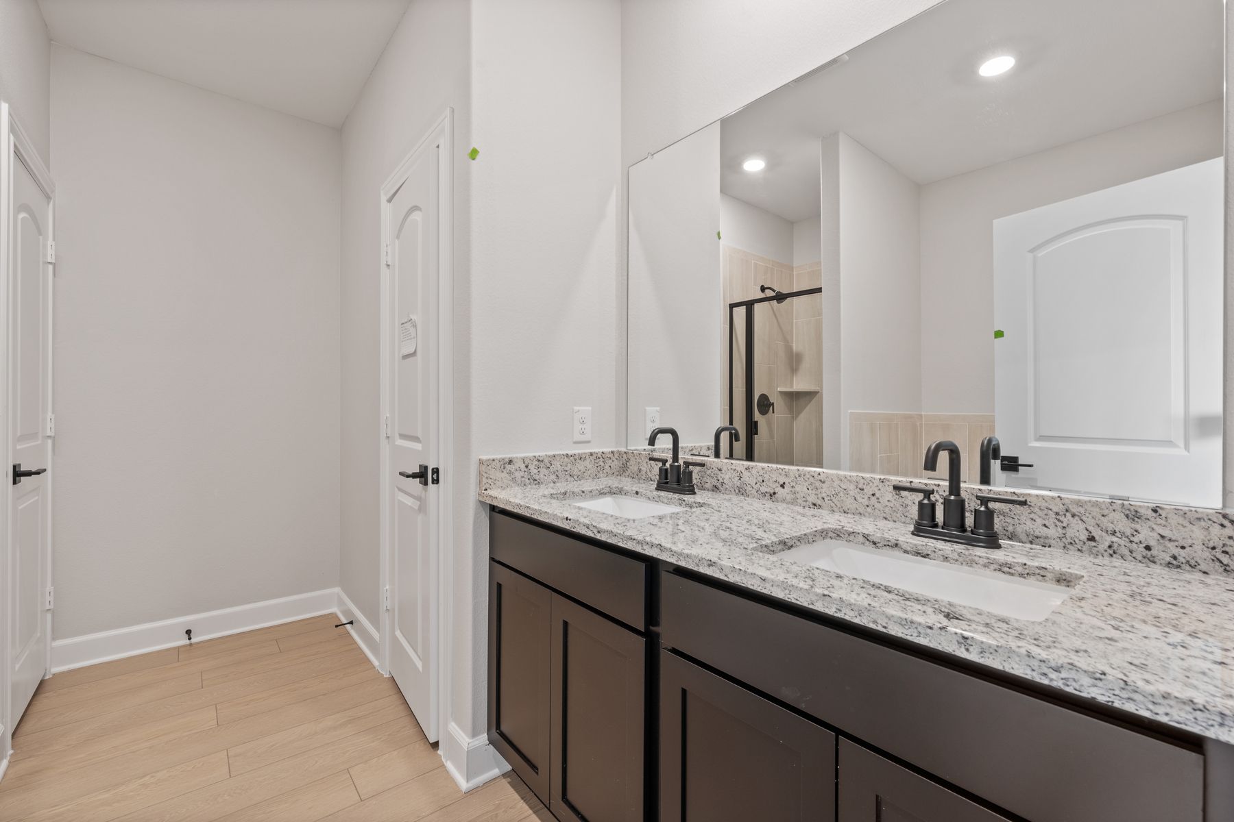 The master bathroom has dual sinks and plenty of vanity space.