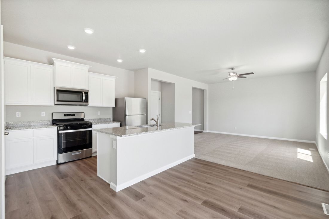 The kitchen of the Platte has sprawling granite countertops.